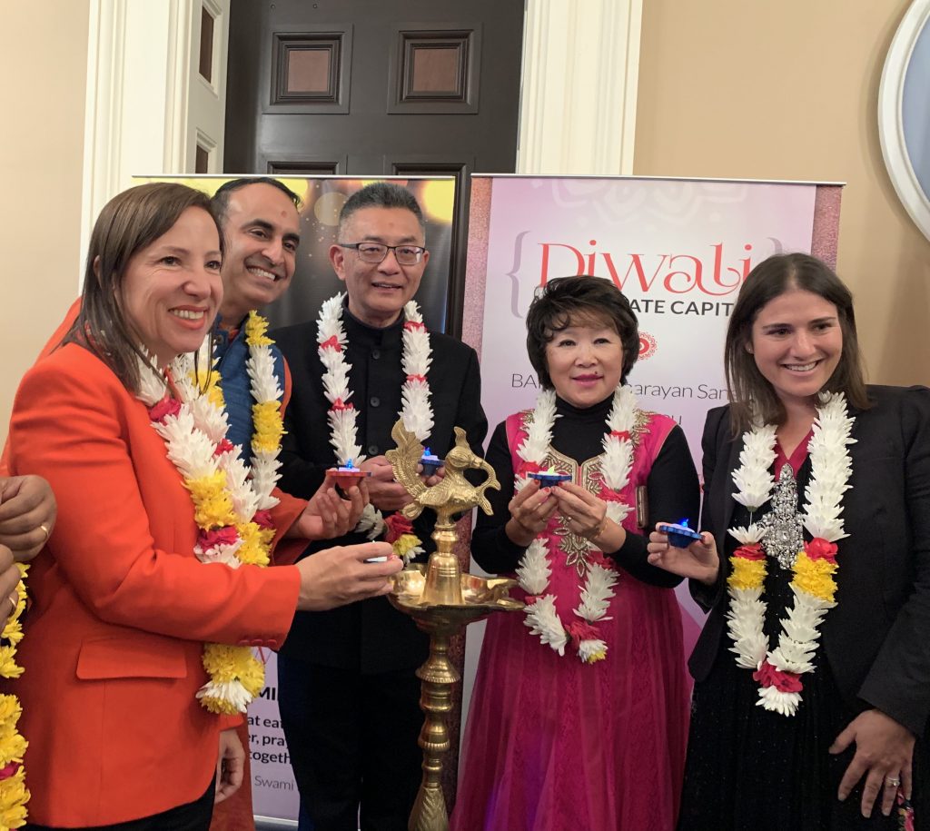 Image of the Lieutenant Governor and others celebrating the Diwali Holiday at the State Capitol