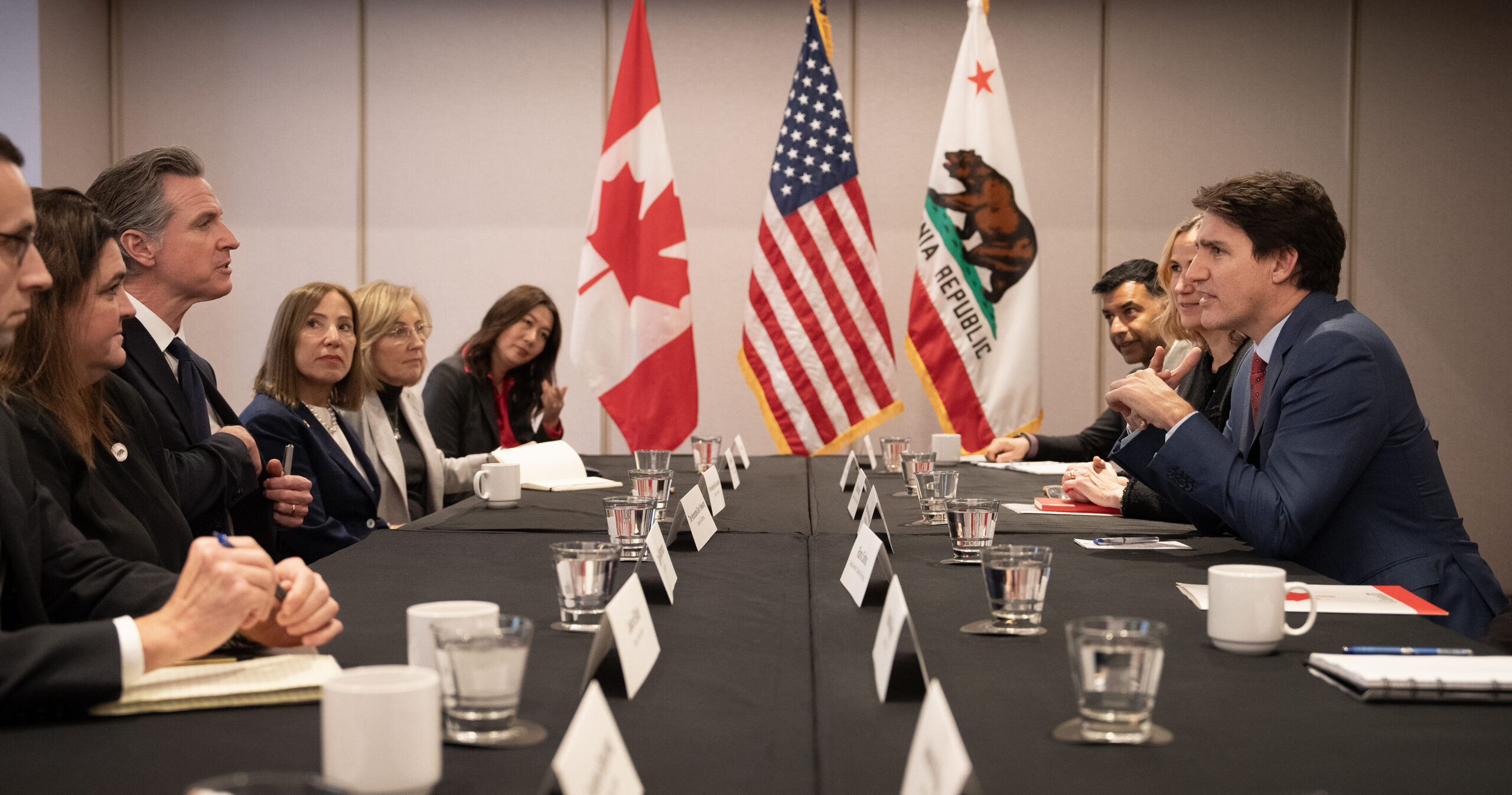 Image of Lt. Gov. Kounalakis, Gov. Newsom, Prime Minister Justin Trudeau of Canada, and other dignitaries at a table talking