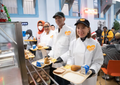 Image of Lieutenant Governor Kounalakis and volunteers serving food at GLIDE in San Francisco
