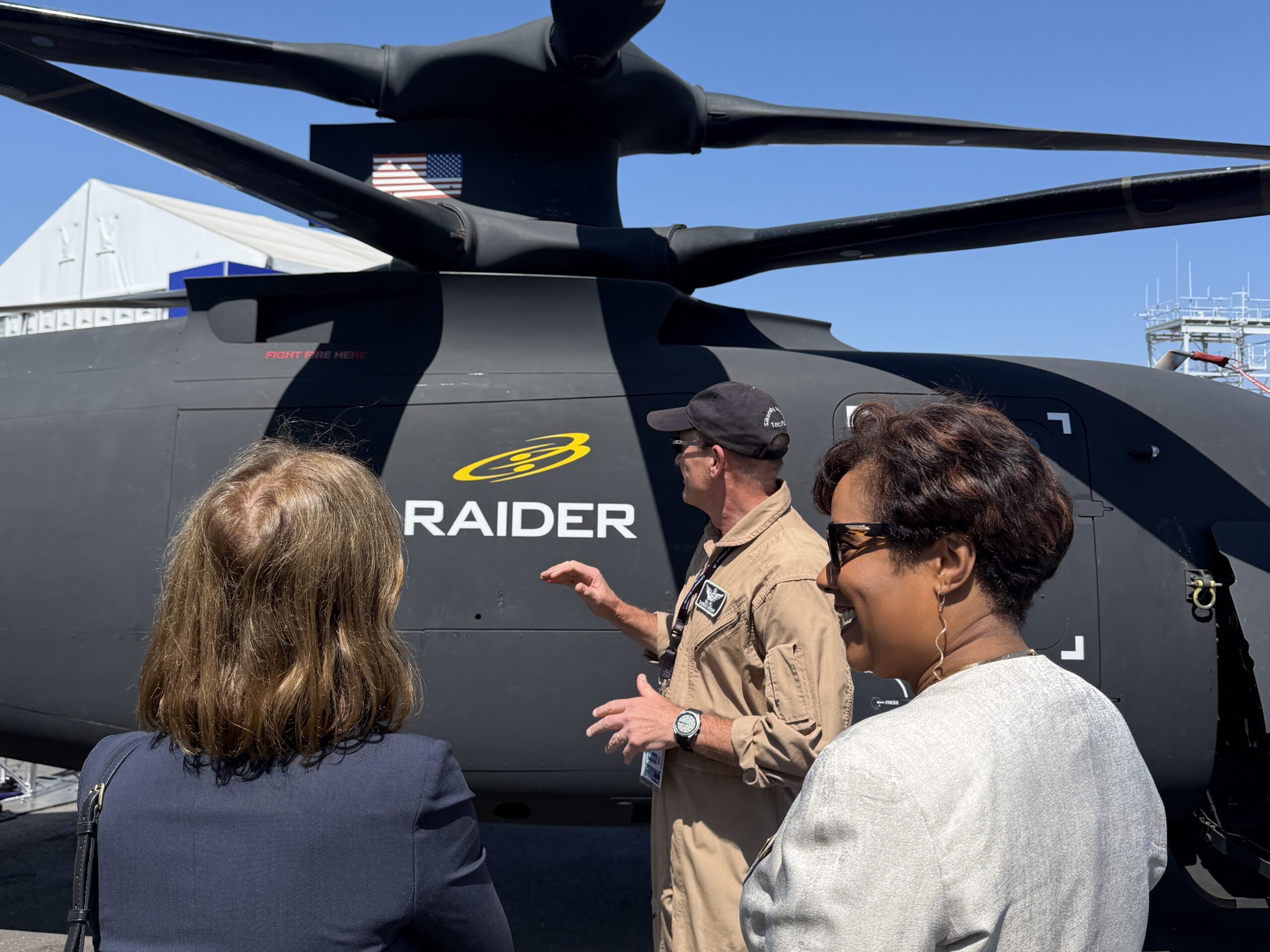Image of Lt. Gov. Kounalakis viewing a Raider Helicopter with others