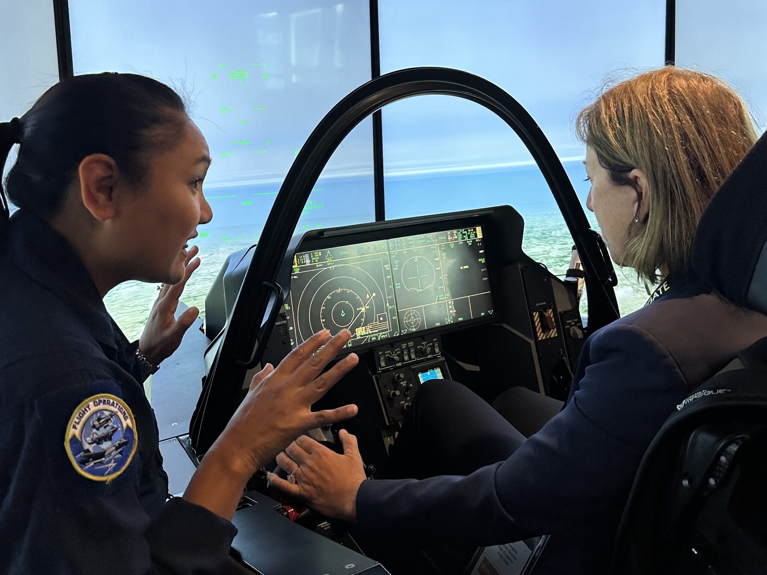 Image of Lt. Gov. Kounalakis in a flight simulator